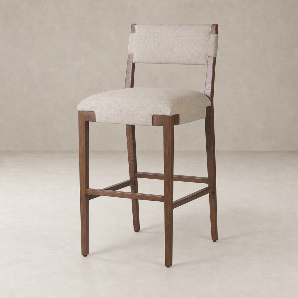 Bex Bar + Counter Stool in Antwerp Natural with a sleek wooden frame and soft fabric seat.