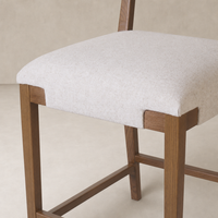 Bex Bar + Counter Stool in Antwerp Natural with soft fabric seat and sturdy wooden legs.