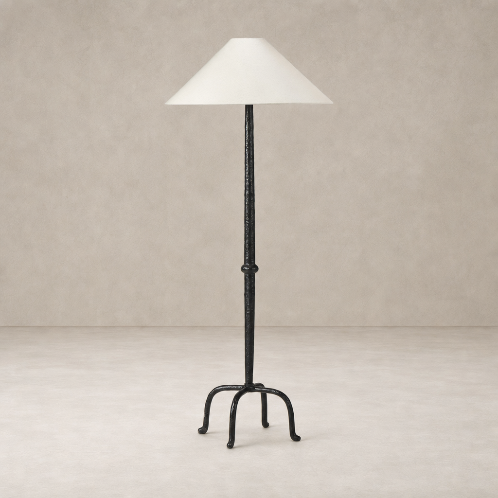 Matte black cast aluminum floor lamp with a conical white shade.