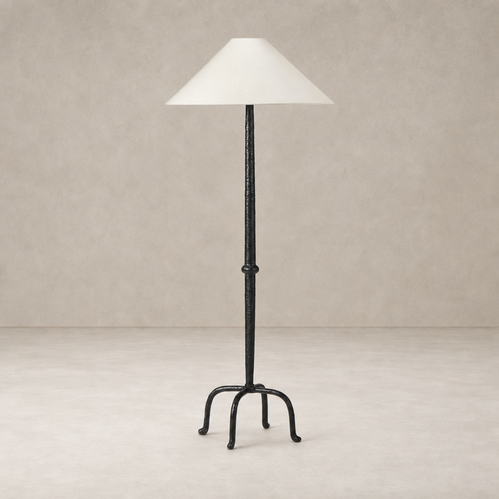 Matte black cast aluminum floor lamp with a conical white shade.
