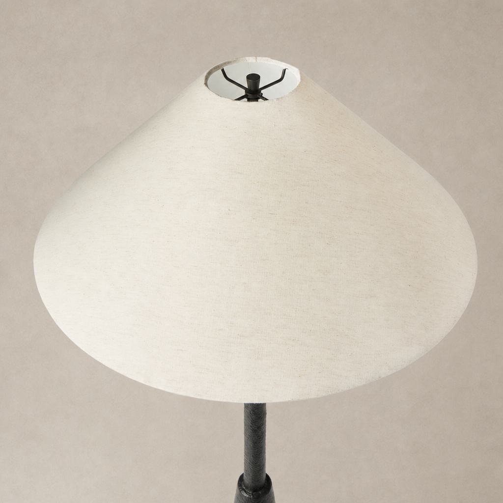 Matte black cast aluminum floor lamp with a wide, conical white shade.