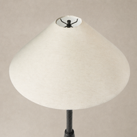 Matte black cast aluminum floor lamp with a wide, conical white shade.