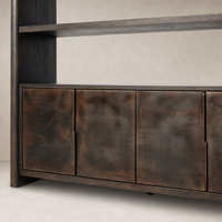 Lazuli Bookcase features espresso oak and sleek metallic cabinet doors.