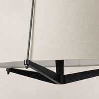 Matte black pendant light with a textured finish and soft beige shade.