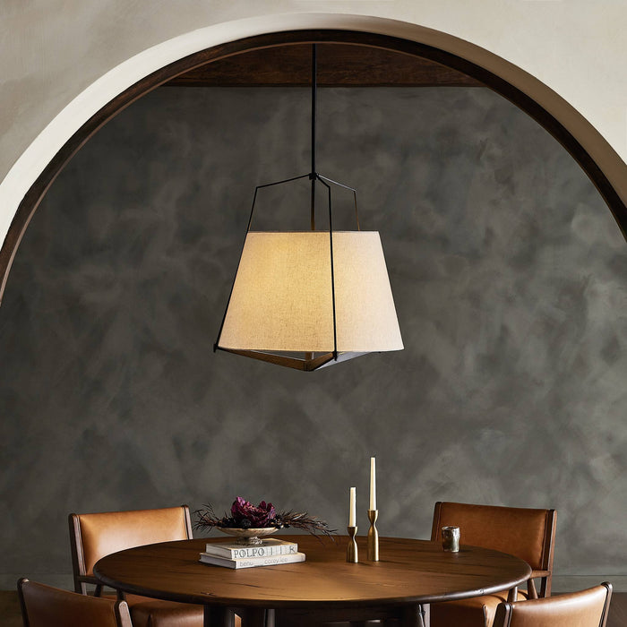 Matte black pendant light featuring a geometric shade above a dining table.