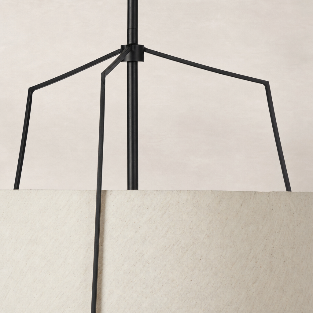 Matte black pendant light with a minimalist design and textured shade.