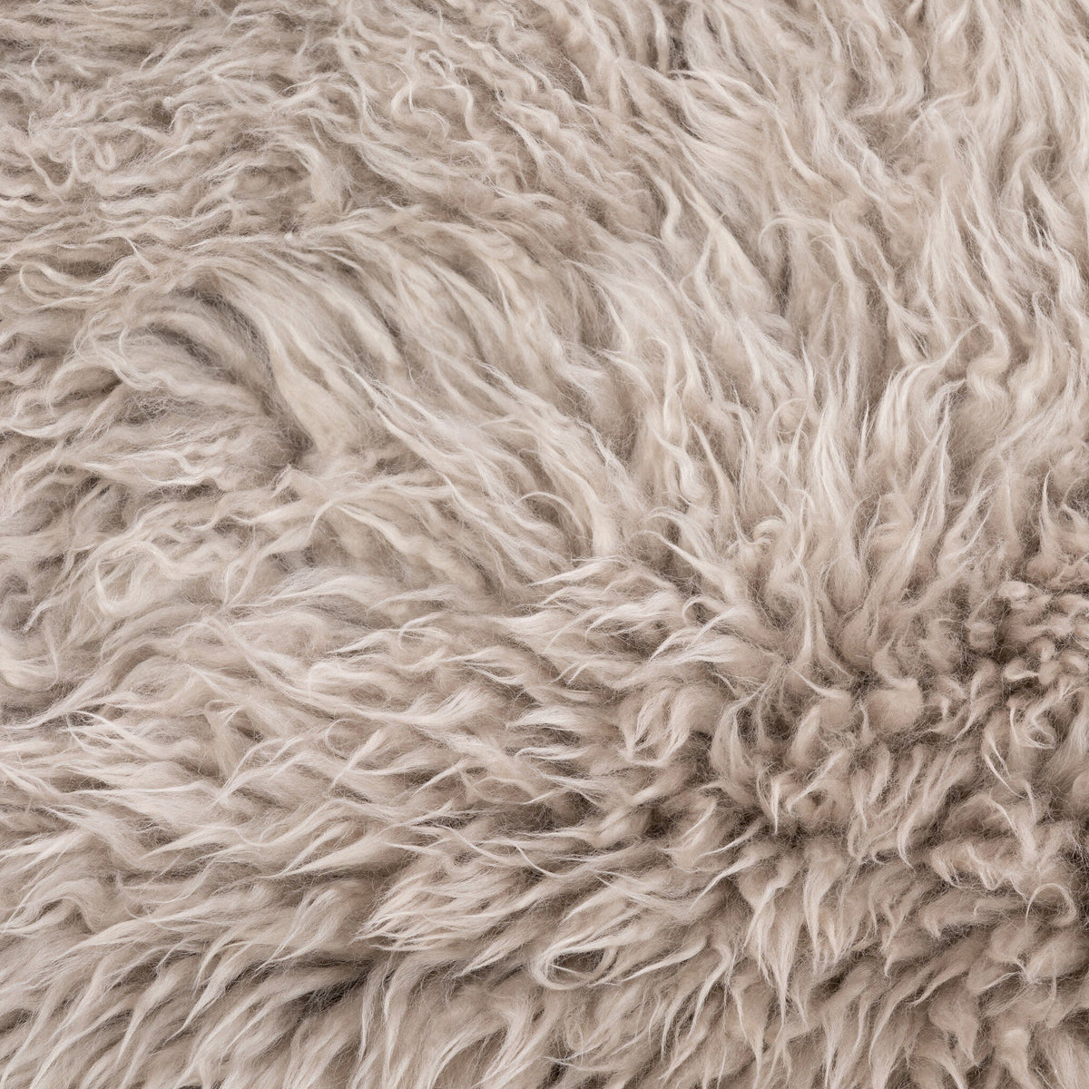 Close-up of soft taupe Mongolian fur texture from the Livia Chair.