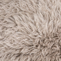 Close-up of soft taupe Mongolian fur texture from the Livia Chair.