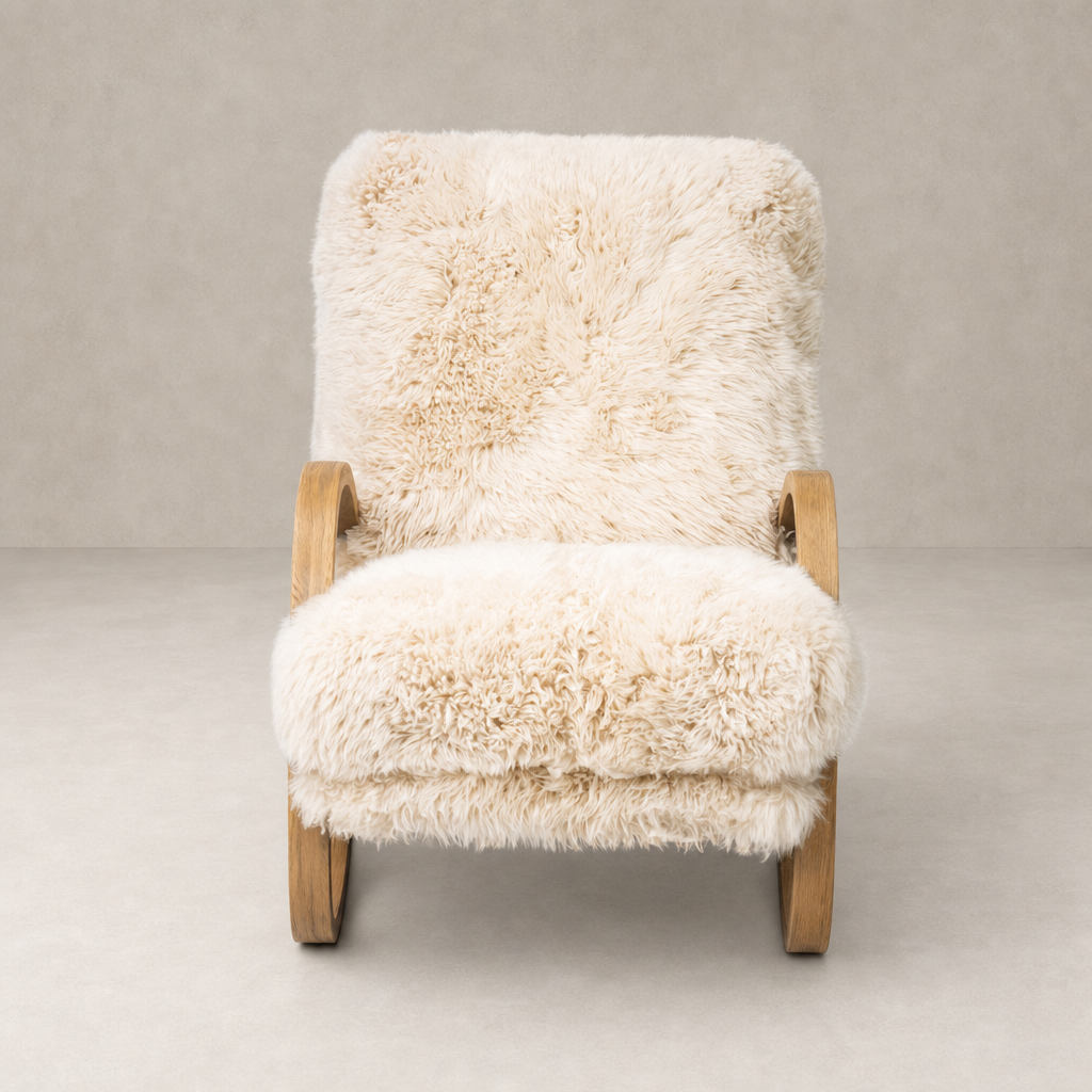 Livia Chair in champagne Mongolian fur with a cozy plush design and natural wood arms.