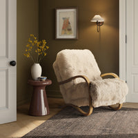 Cozy Livia Chair in champagne Mongolian fur with elegant wood arms in a stylish room.
