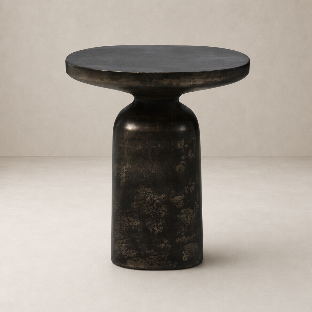 Odette End Table featuring a rounded, textured black finish and modern silhouette.