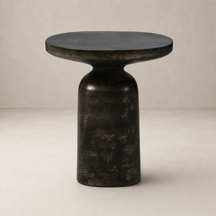 Odette End Table featuring a rounded, textured black finish and modern silhouette.