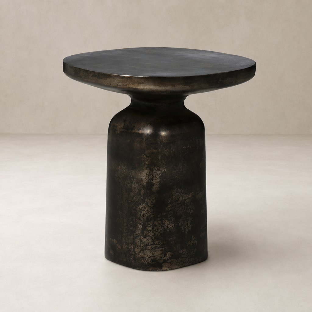 Stylish Odette End Table with a rounded top and sculptural black finish.