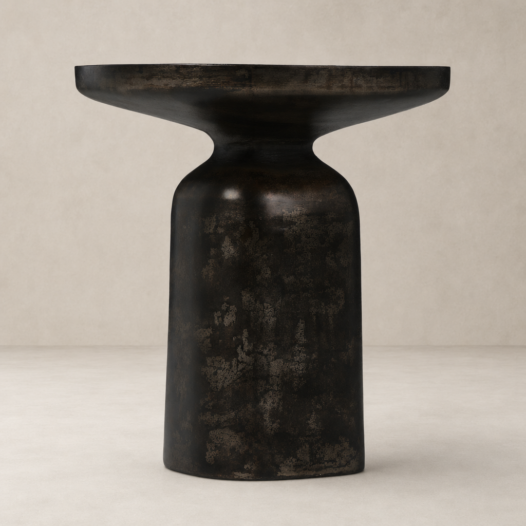 Odette End Table featuring a sleek black finish and unique hourglass shape.