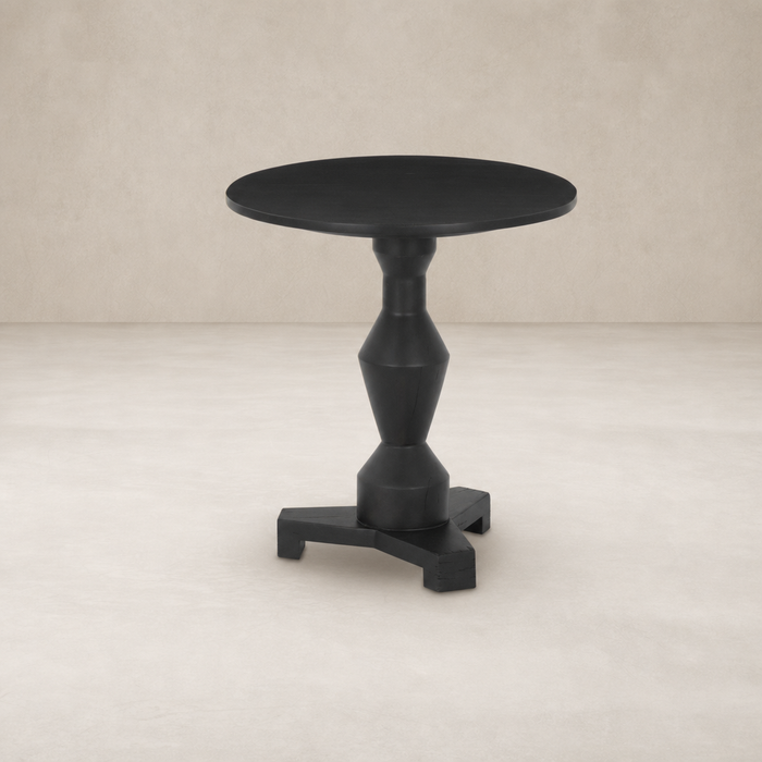 Stylish Neri End Table with a round top and sculpted black base.