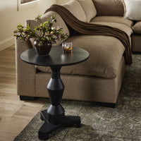 Neri End Table in black features a stylish round top and unique base design.