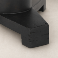 Close-up of the Neri End Table showcasing its black wood finish and sturdy base.