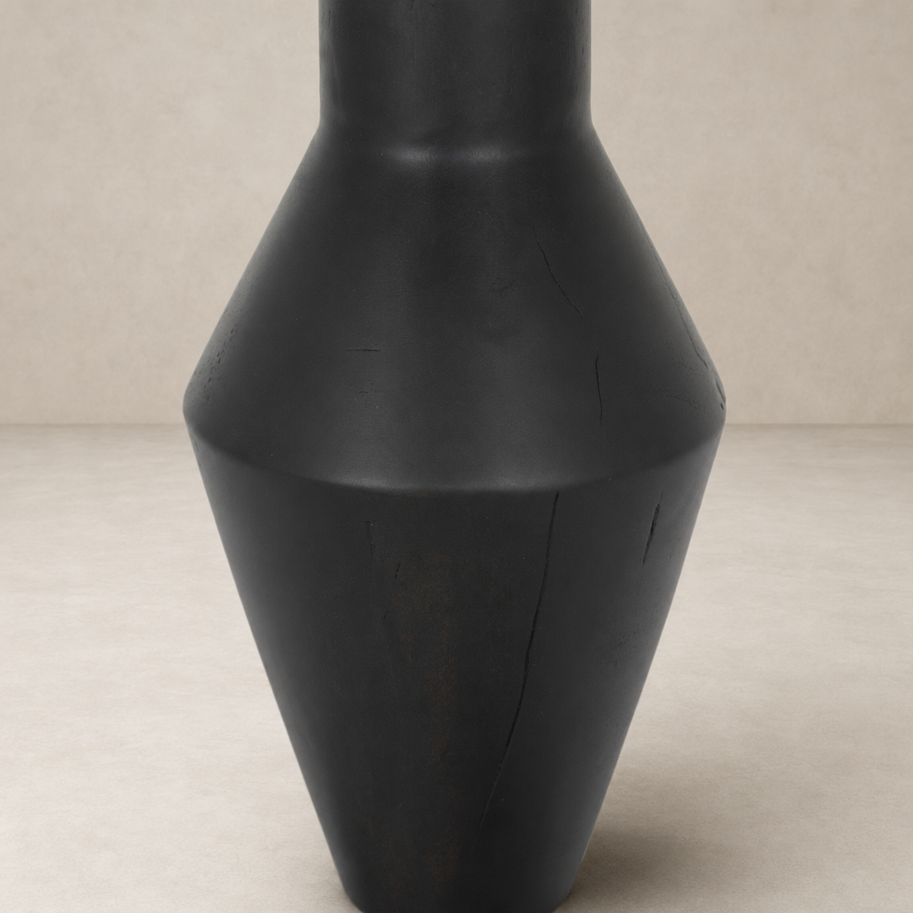 Sleek black Neri End Table with geometric shape and smooth finish.