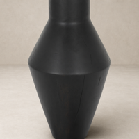 Sleek black Neri End Table with geometric shape and smooth finish.
