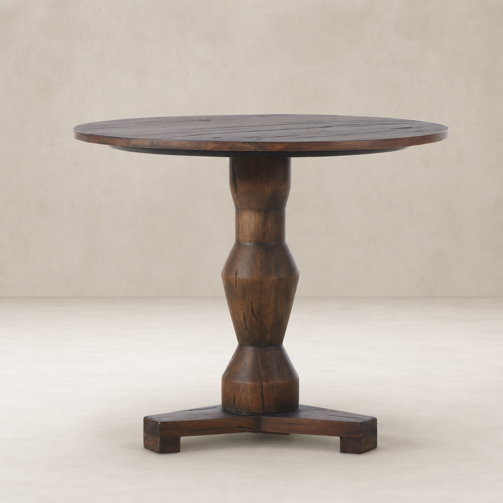 Riva Large End Table features a round top and sculptural wooden base with a natural finish.