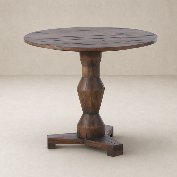 Riva Large End Table with round top and chunky, textured wooden pedestal base.