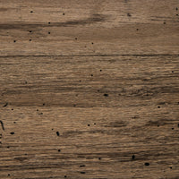 Close-up of Brisa Dining Table in rustic wormwood oak showcasing natural grain and texture.