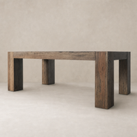 Brisa Dining Table in Rustic Wormwood Oak with sturdy, square legs and a textured finish.