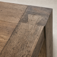 Brisa Dining Table showcasing rustic wormwood oak texture and detailed craftsmanship.