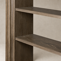 Detailed view of Montez Bookcase's weathered hazel oak shelves and textured finish.