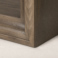Close-up of Montez Bookcase's weathered hazel oak finish and detailed corner joinery.