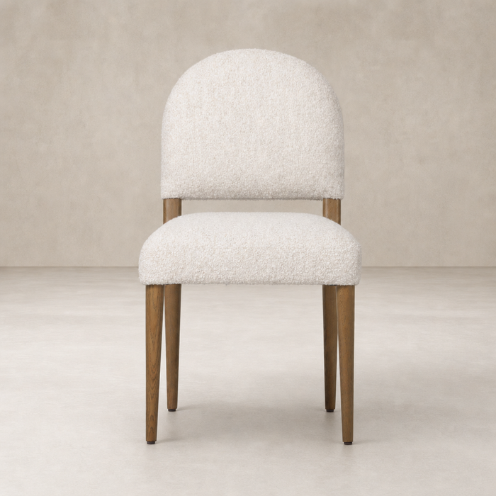 Marfa Dining Chair in Somerton Ash with plush, textured upholstery and rounded backrest.