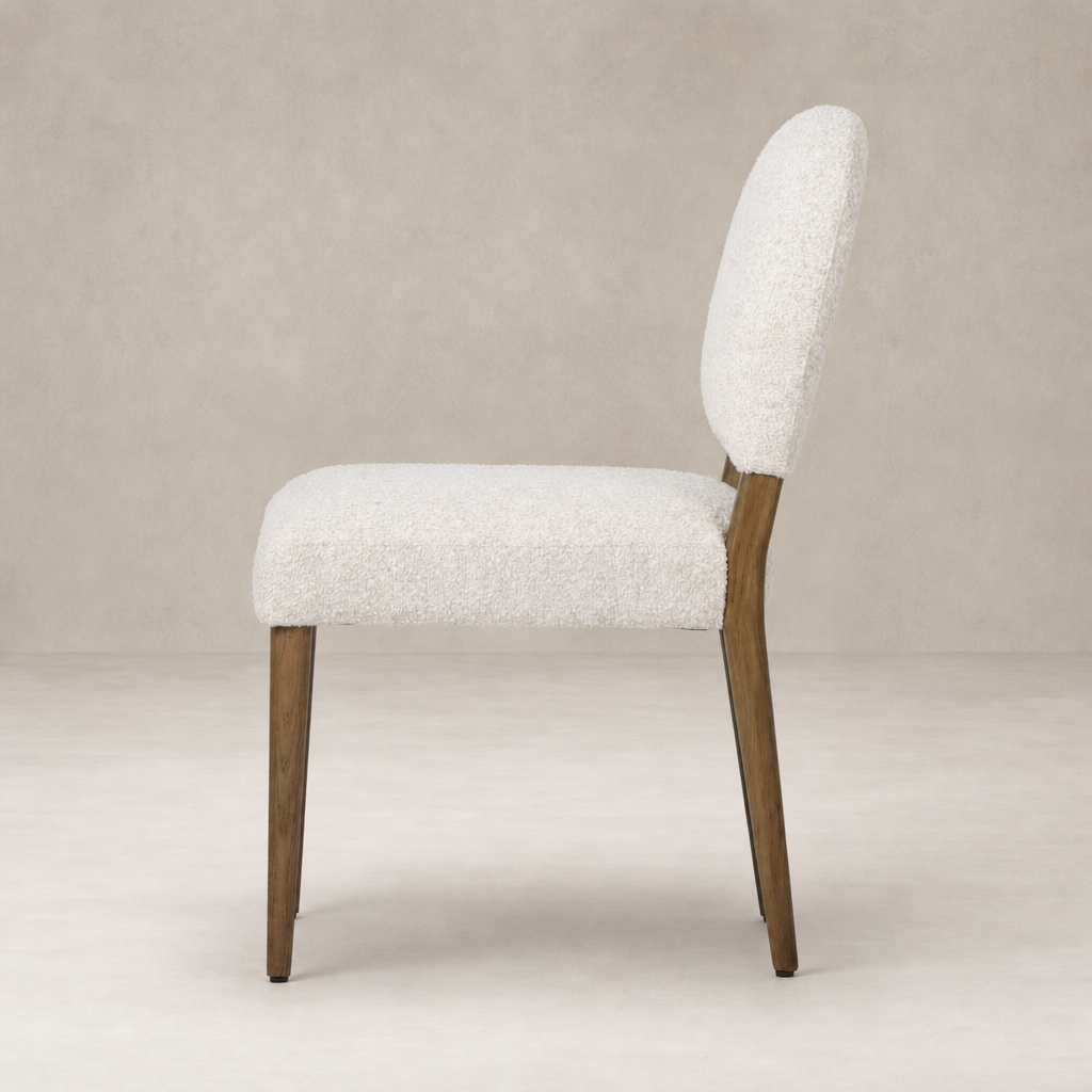 Marfa Dining Chair in Somerton Ash with soft, textured upholstery and sleek wooden legs.