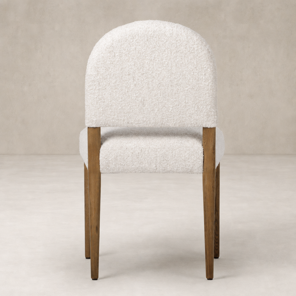 Marfa Dining Chair in Somerton Ash with plush textured upholstery and wooden legs.