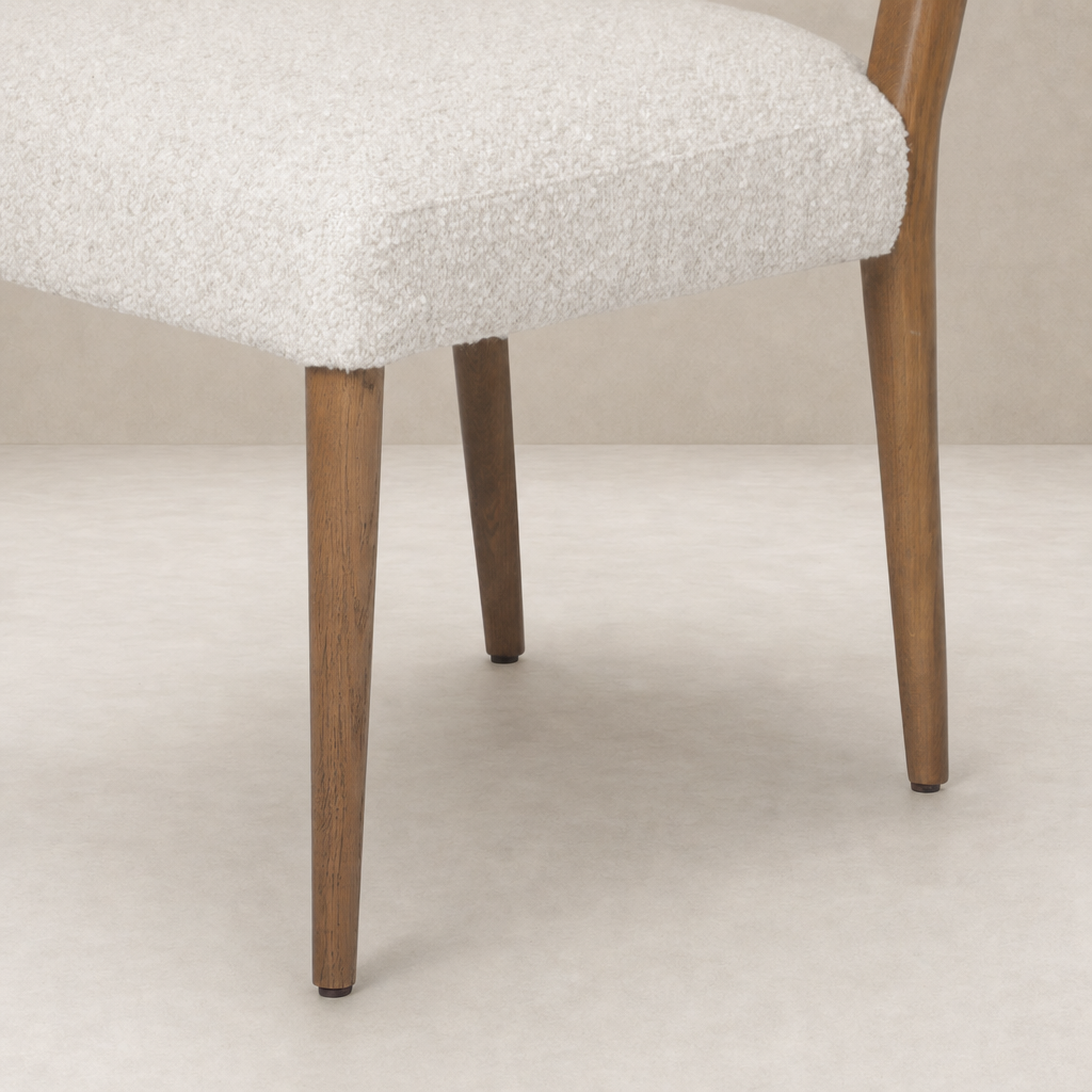 Marfa Dining Chair featuring a soft Somerton Ash upholstery and sturdy wood legs.