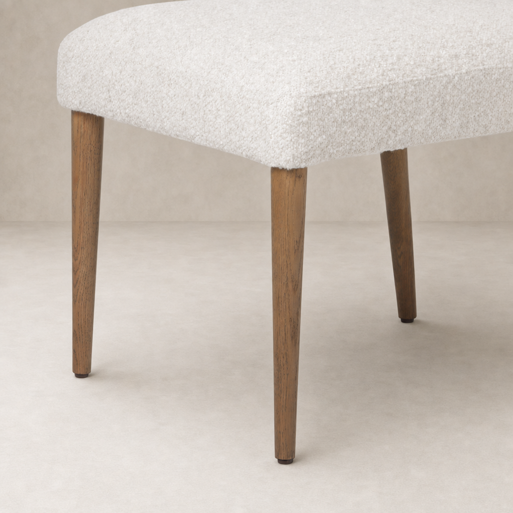 Marfa Dining Chair in Somerton Ash with textured fabric and elegant wooden legs.
