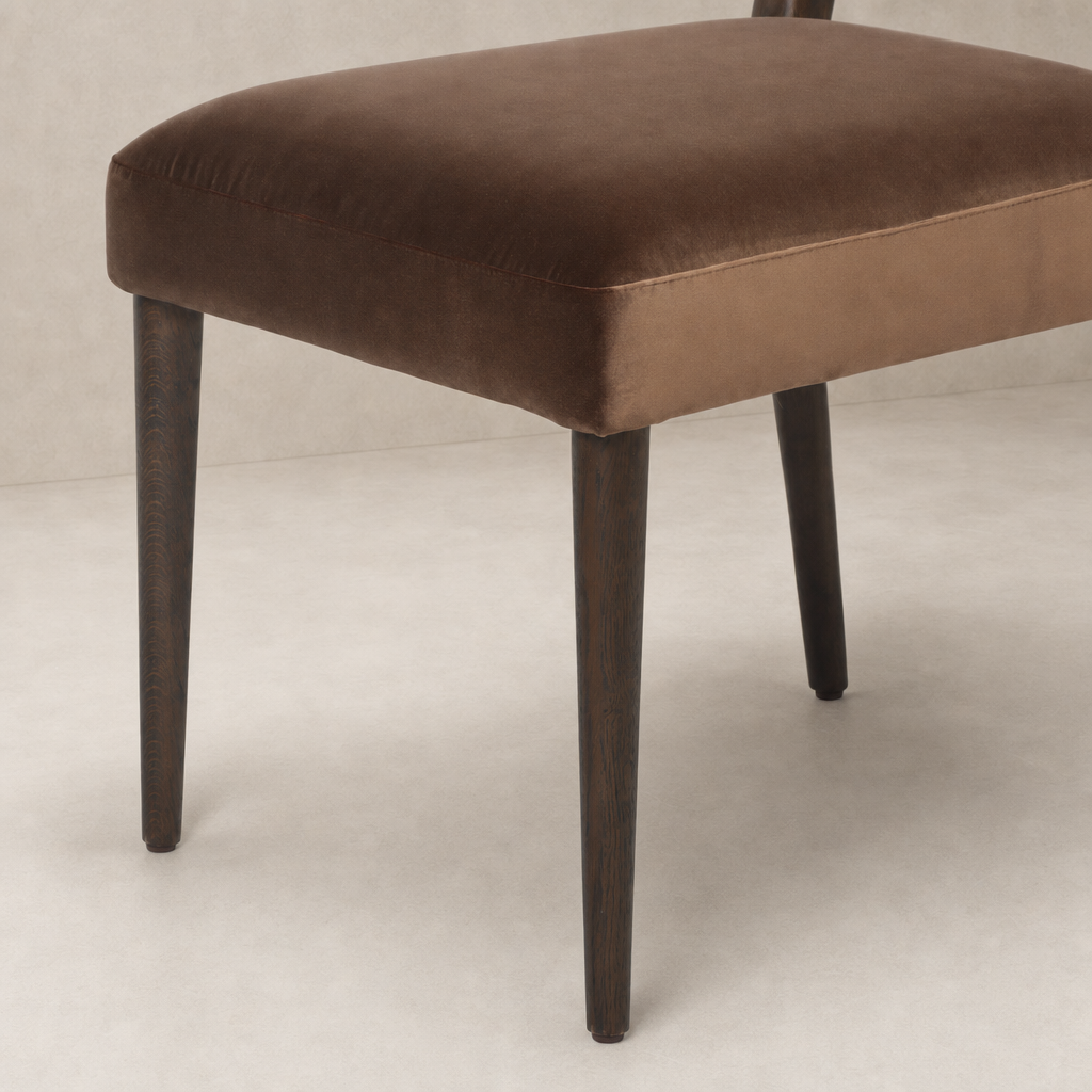 Marfa Dining Chair in Sapphire Coco featuring plush velvet upholstery and dark wooden legs.
