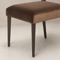 Marfa Dining Chair in Sapphire Coco featuring plush velvet upholstery and dark wooden legs.
