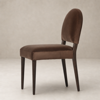 Marfa Dining Chair in Sapphire Coco features a smooth, rounded back and elegant wooden legs.