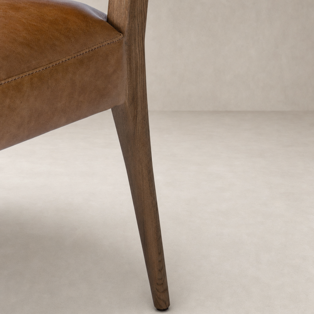 Marfa Dining Chair in Chaps Saddle with sleek wooden legs and stylish upholstery.