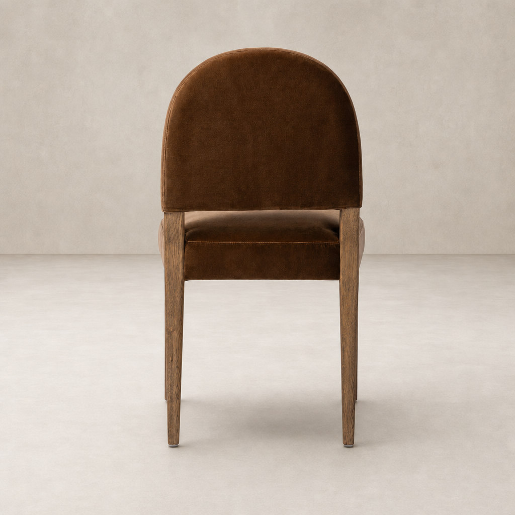 Marfa Dining Chair in Surrey Ochre with curved back and wooden legs.