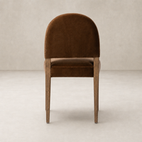 Marfa Dining Chair in Surrey Ochre with curved back and wooden legs.