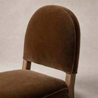 Marfa Dining Chair in Surrey Ochre, featuring a plush velvet finish and rounded back.