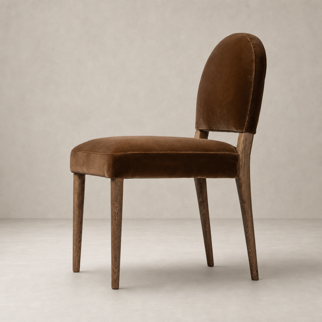 Marfa Dining Chair in Surrey Ochre features a plush velvet seat and curved back.