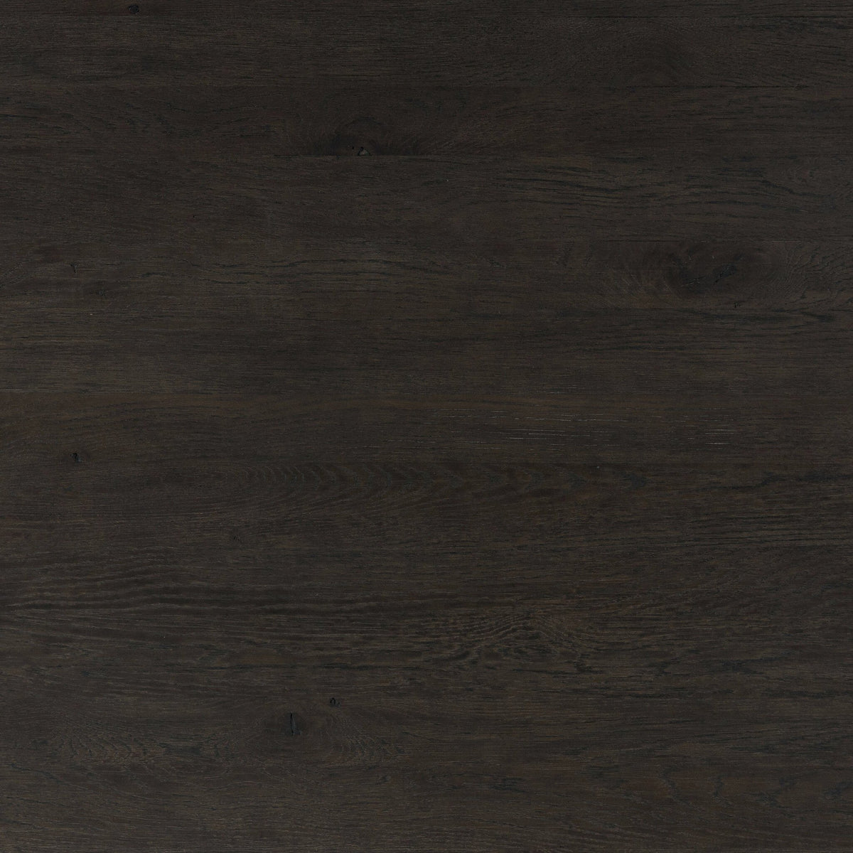 Close-up of the cracked smoked black finish on the Stratton Extension Dining Table.