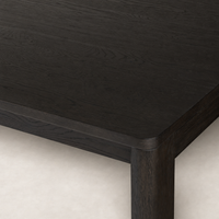 Stratton Extension Dining Table with a sleek cracked smoked black wood finish.