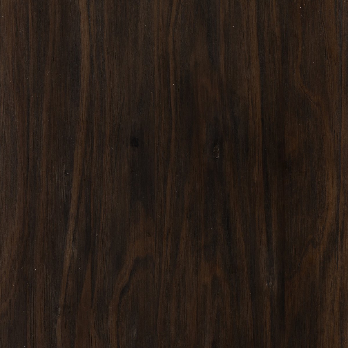 Detail of the Maelle Console Table showcasing its rich, dark wood grain and elegant finish.