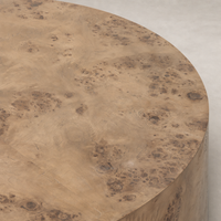 Calla Coffee Table in caramel burl showcasing a rich, textured surface.