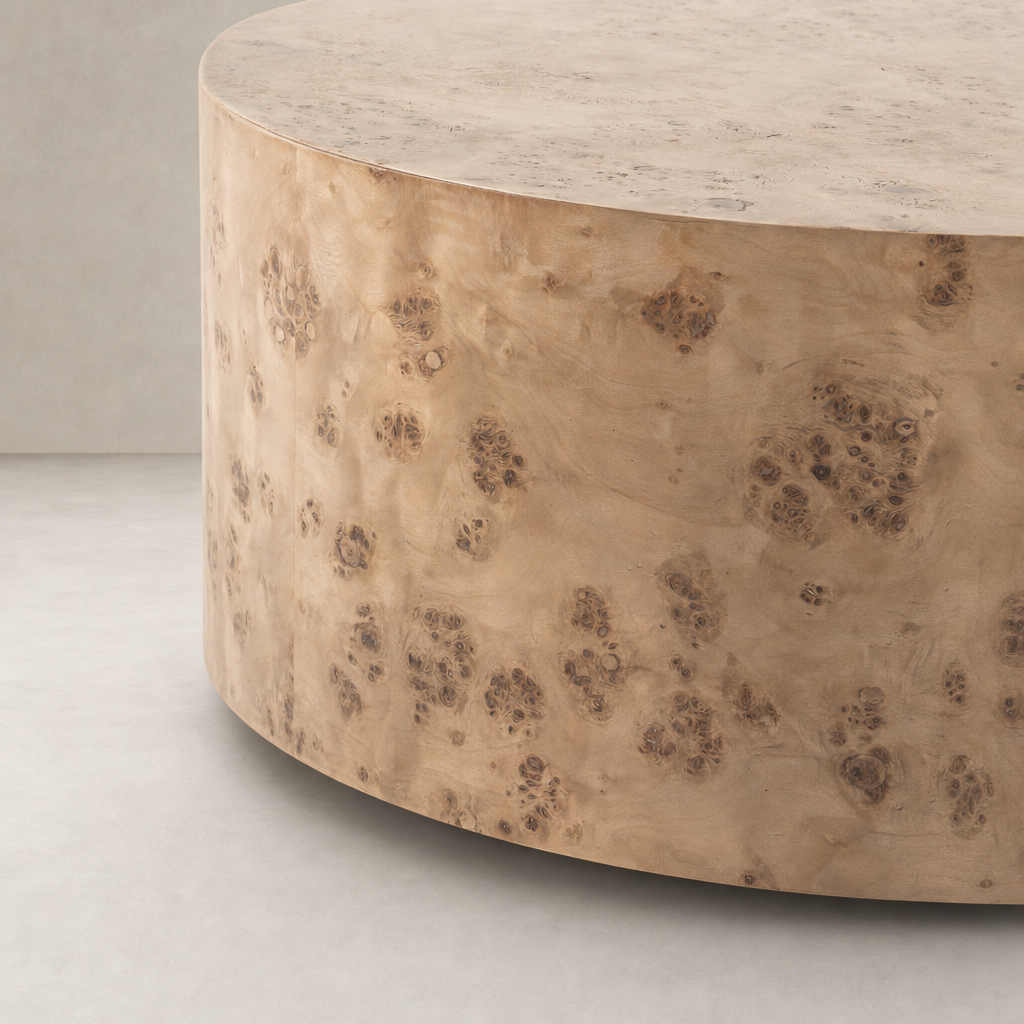 Calla Coffee Table in caramel burl features a smooth, rounded surface with unique textures.