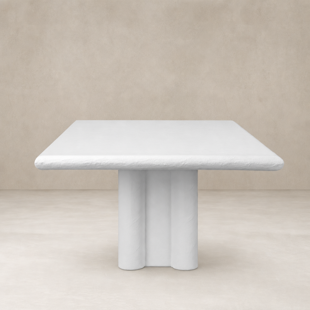 Selby Dining Table in plaster molded concrete with a sleek, modern design.