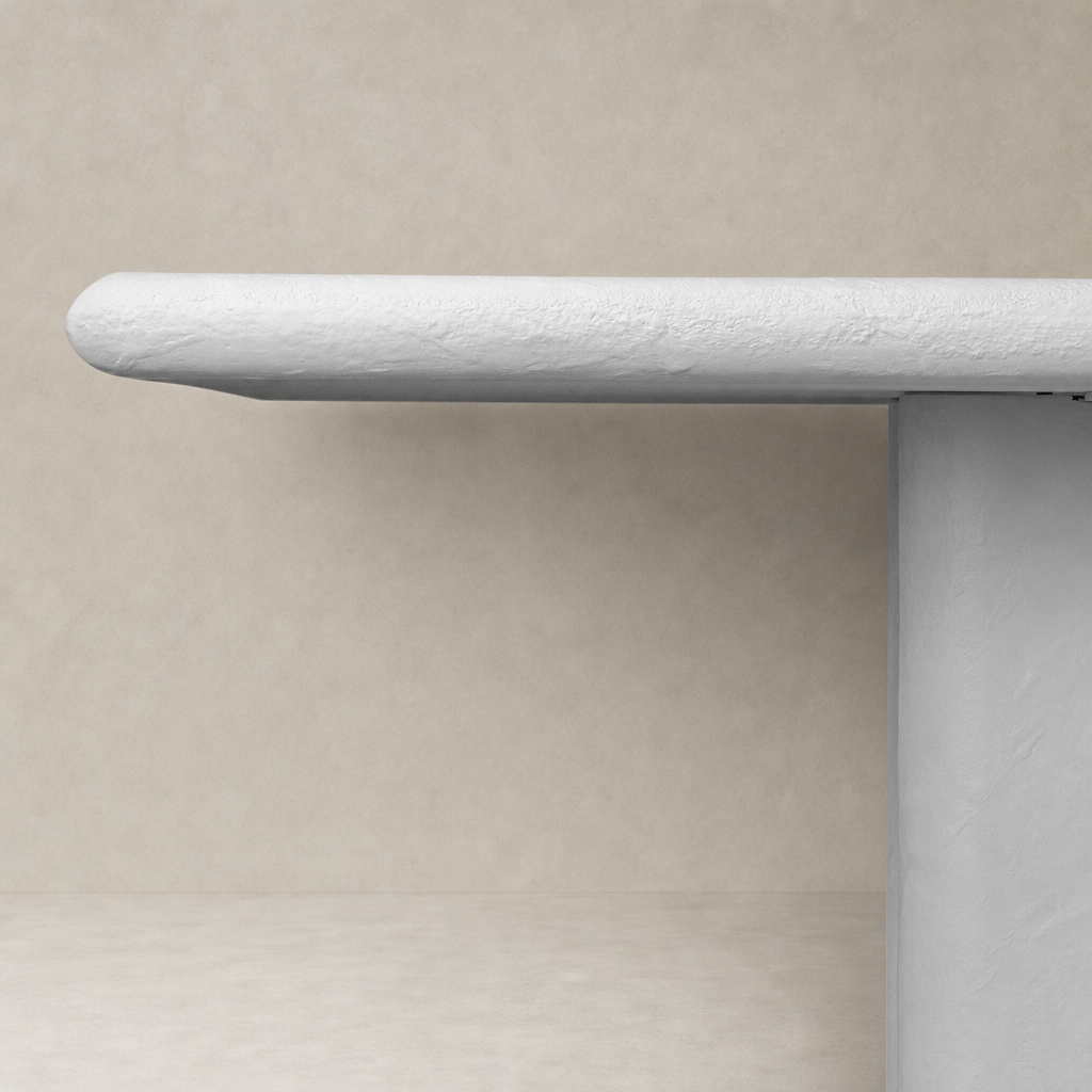 Selby Dining Table in plaster molded concrete with a smooth, rounded edge design.